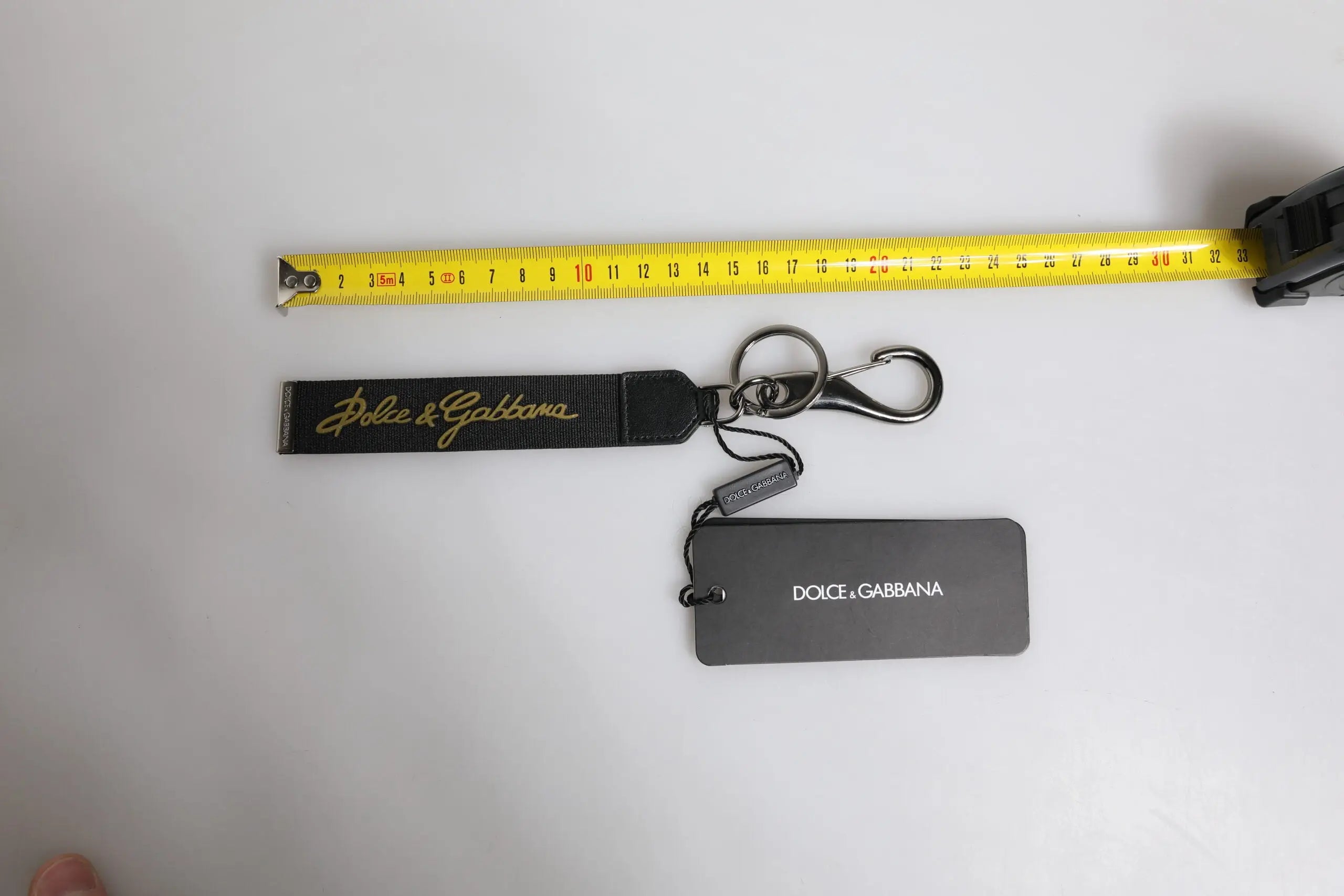 Porte-clés dolce & gabbana noir en cuir avec logo doré et mousqueton en métal pour homme en nylon, laiton et argent
