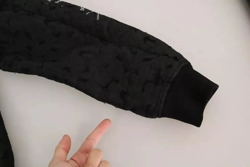Manche de sweat-shirt matelassé noir dolce & gabbana avec motif sombre subtil et poignets côtelés