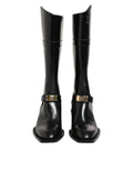 Dolce & gabbana bottes montantes en cuir verni noir avec plaques logo et boucles dorées sur le mollet