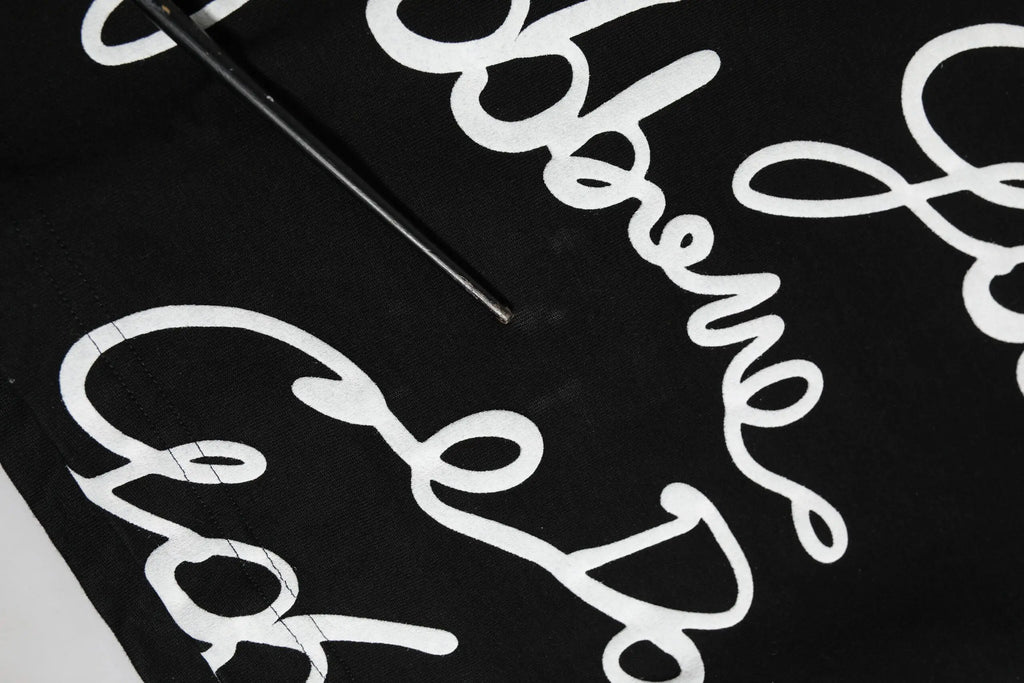 T-shirt dolce & gabbana en coton noir avec logo blanc en écriture cursive audacieuse