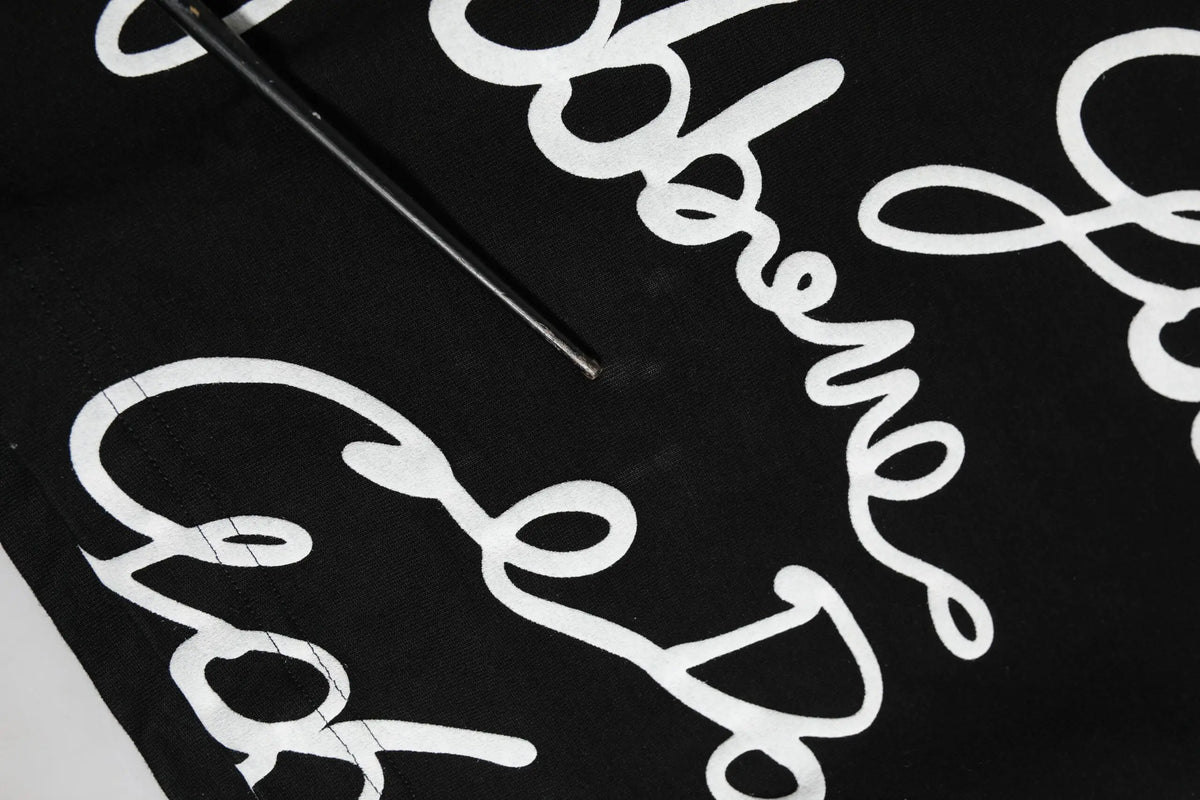 T-shirt dolce & gabbana en coton noir avec logo blanc en écriture cursive audacieuse