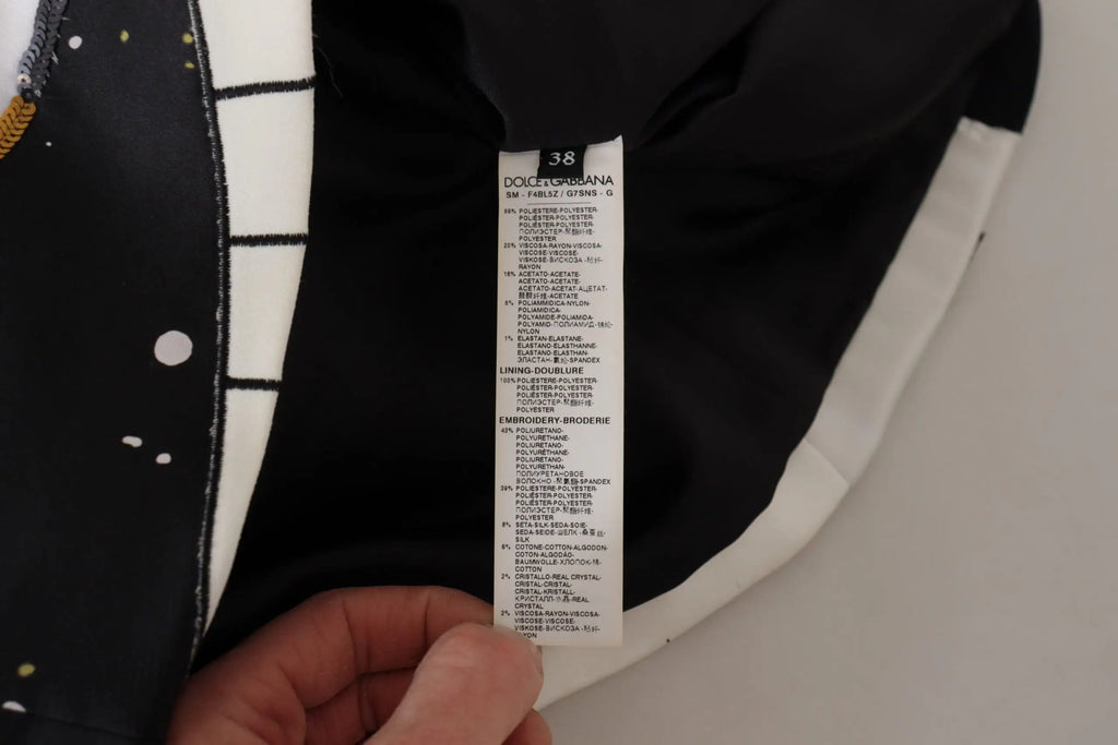 Étiquette de soin en tissu blanc avec texte noir de dolce & gabbana pour jupe piano noire à sequins love clock