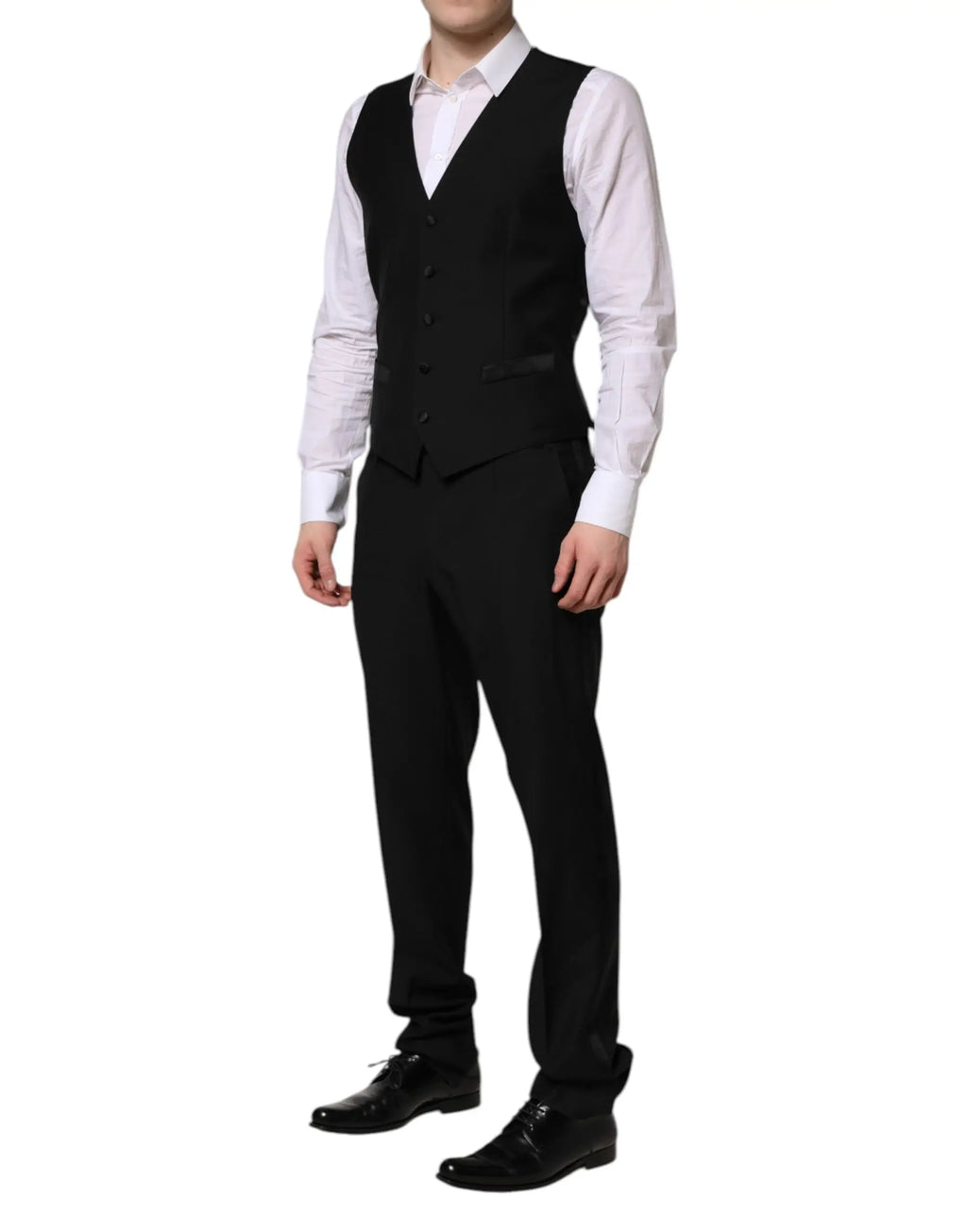 Dolce & Gabbana veste noire martini en tissu sobre à cinq boutons et revers crantés portée sur chemise blanche