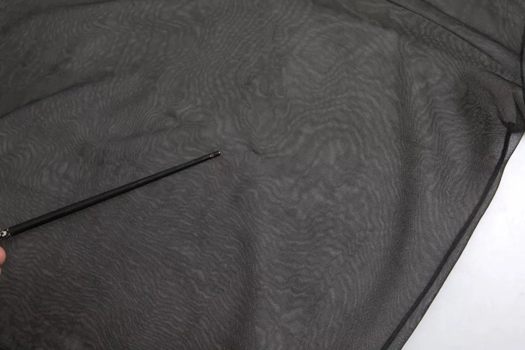 Dolce & Gabbana blouse top noir en maille transparente avec motif texturé subtil en tissu mesh léger