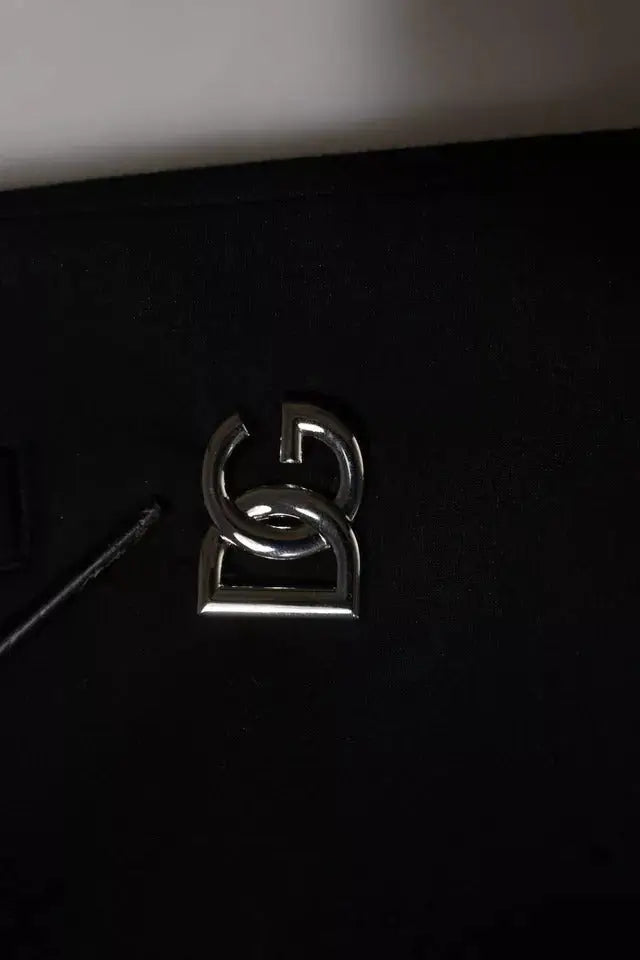 Logo argenté métallique avec design incurvé entrelacé sur un pantalon de survêtement noir dolce & gabbana en modal pour homme