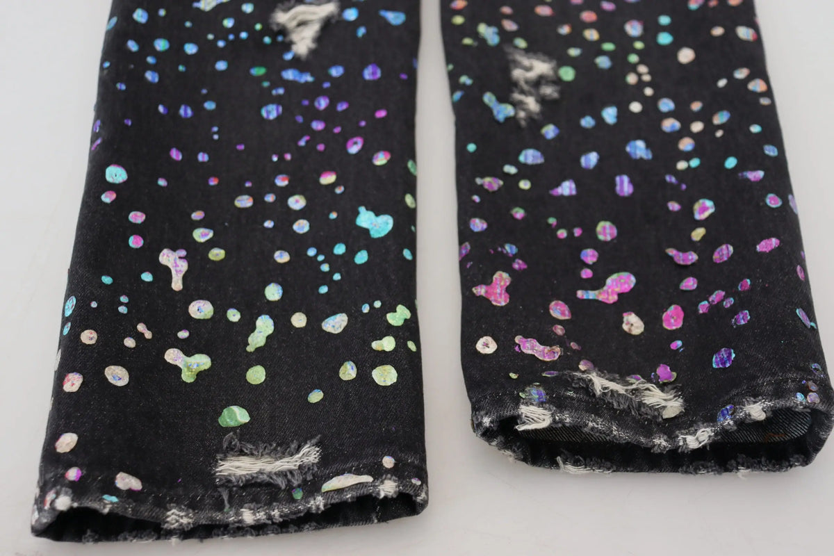 Dolce & gabbana black denim leggings with vibrant iridescent rainbow paint splatter and distressed frayed hems