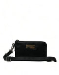 Sacoche bandoulière michael kors noire en cuir avec plaque métallique et sangle ajustable sur clutch pochette dolce & gabbana nylon