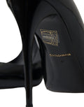 Escarpins dolce gabbana noirs en cuir verni avec talons hauts et logo doré sur la semelle intérieure