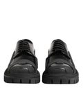 Dolce & gabbana chaussures derby trekking en cuir verni noir avec semelle en caoutchouc à lacets et design angulaire