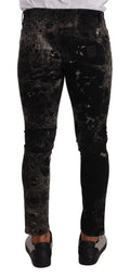 Jeans slim fit dolce & gabbana noirs à motif splatter gris avec finition denim texturée délavée