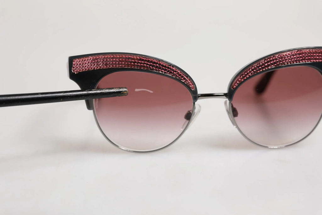 Lunettes de soleil dolce gabbana dg6109 cat eye noires avec bande pailletée rose doré et verres dégradés roses
