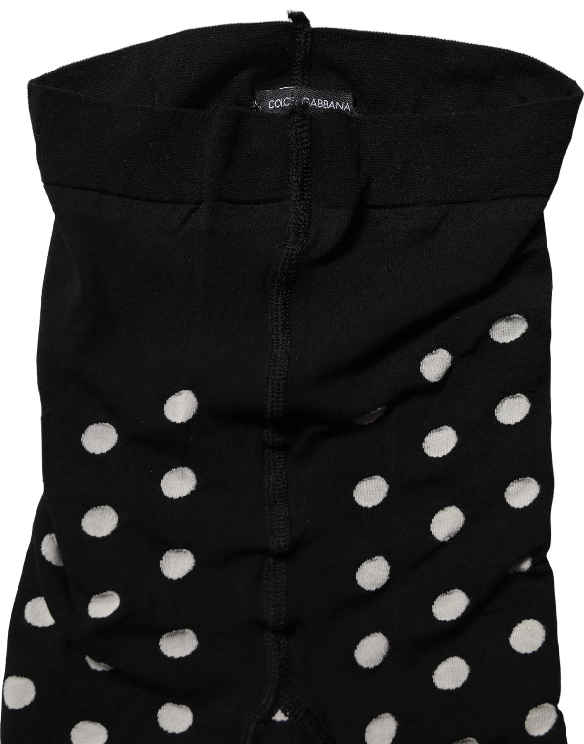 Robe noire dolce & gabbana à pois blancs portée avec des bas résille noirs polka dot fishnet pantyhose