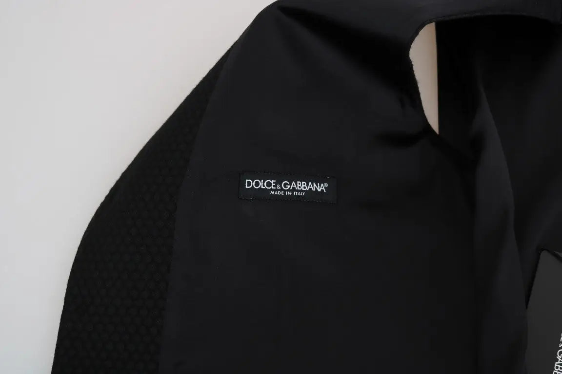 Dolce & Gabbana veste noire avec motif à pois en tissu lisse et coupe ajustée élégante
