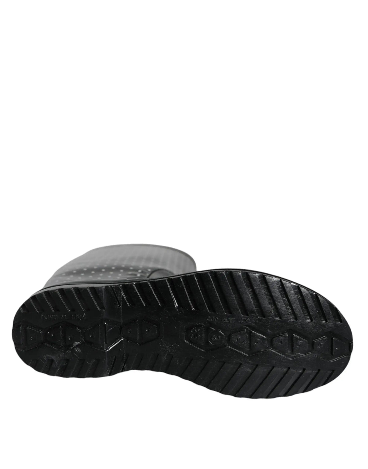 Semelle en caoutchouc noire texturée avec motif cranté et logo embossé des bottes noires à pois dolce & gabbana
