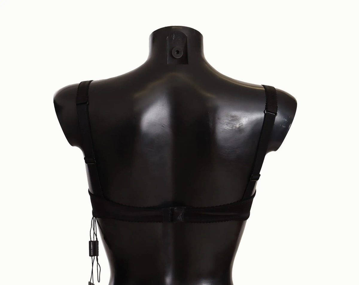 Dolce & gabbana balconette noir en satin à pois avec dentelle et bretelles élastiques réglables sur mannequin