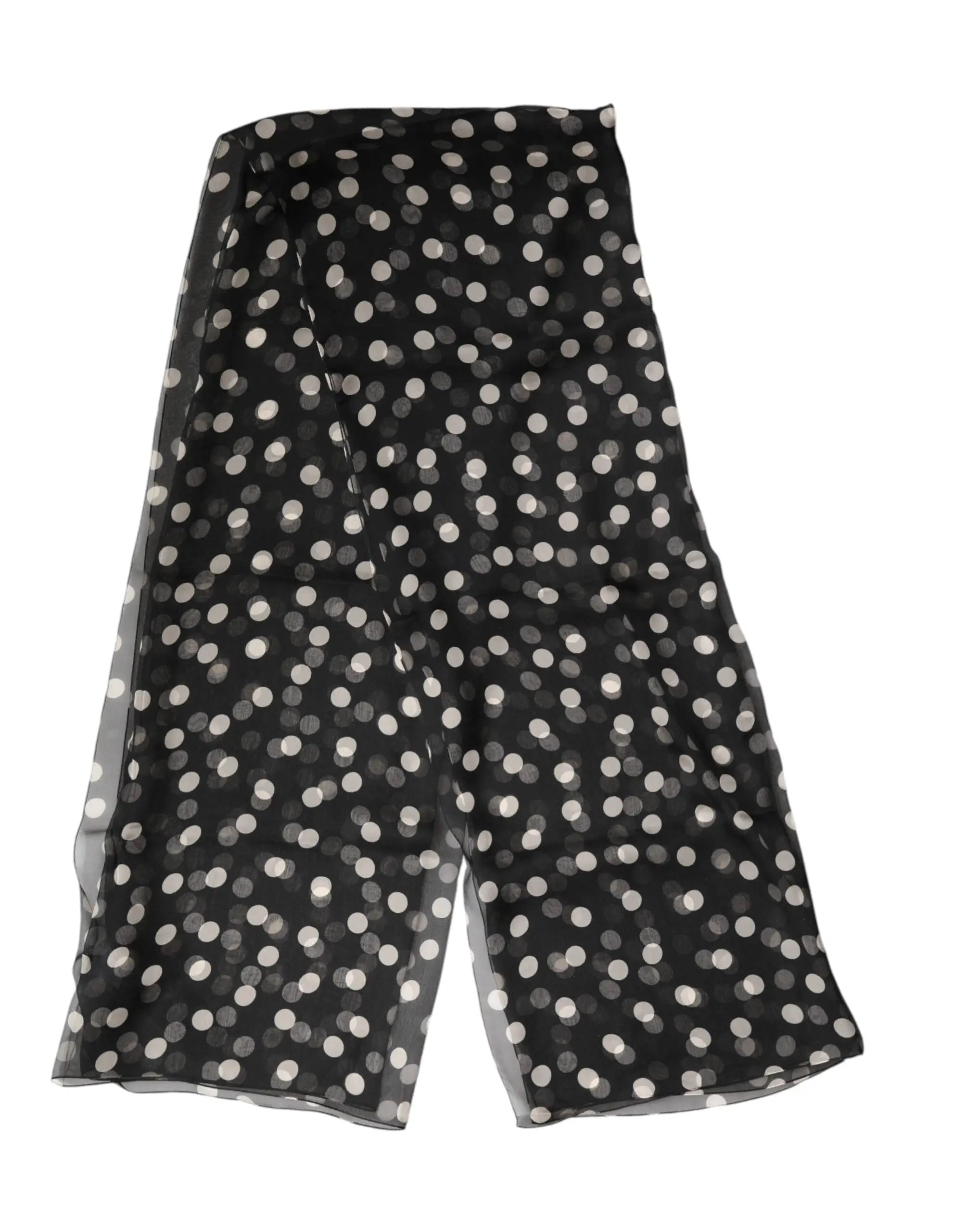 Jupe portefeuille en mousseline noire à pois blancs avec tissu transparent et fluide dolce gabbana