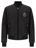 Dolce & Gabbana bomber noir en polyamide avec écusson brodé argenté sur la poitrine gauche