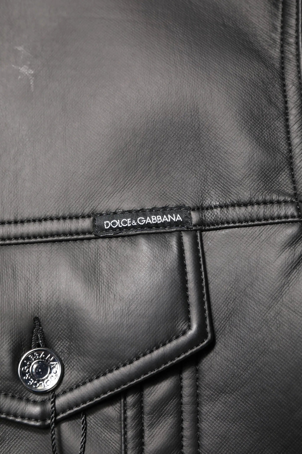 Veste biker dolce gabbana noire en polyester avec boutons argentés et étiquette dolce gabbana en cuir noir