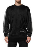 Pull noir dolce gabbana en polyester avec manches en mesh transparent et signature argentée subtile sur le devant