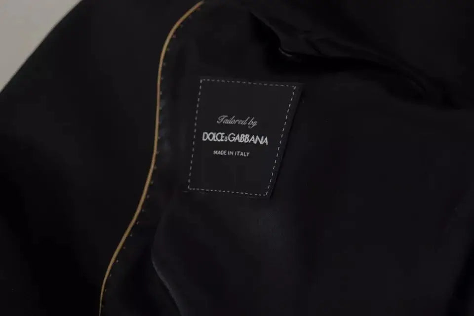Étiquette en tissu noire avec couture blanche et texte tailleur par dolce & gabbana made in italy sur blazer noir polyester simple boutonnage