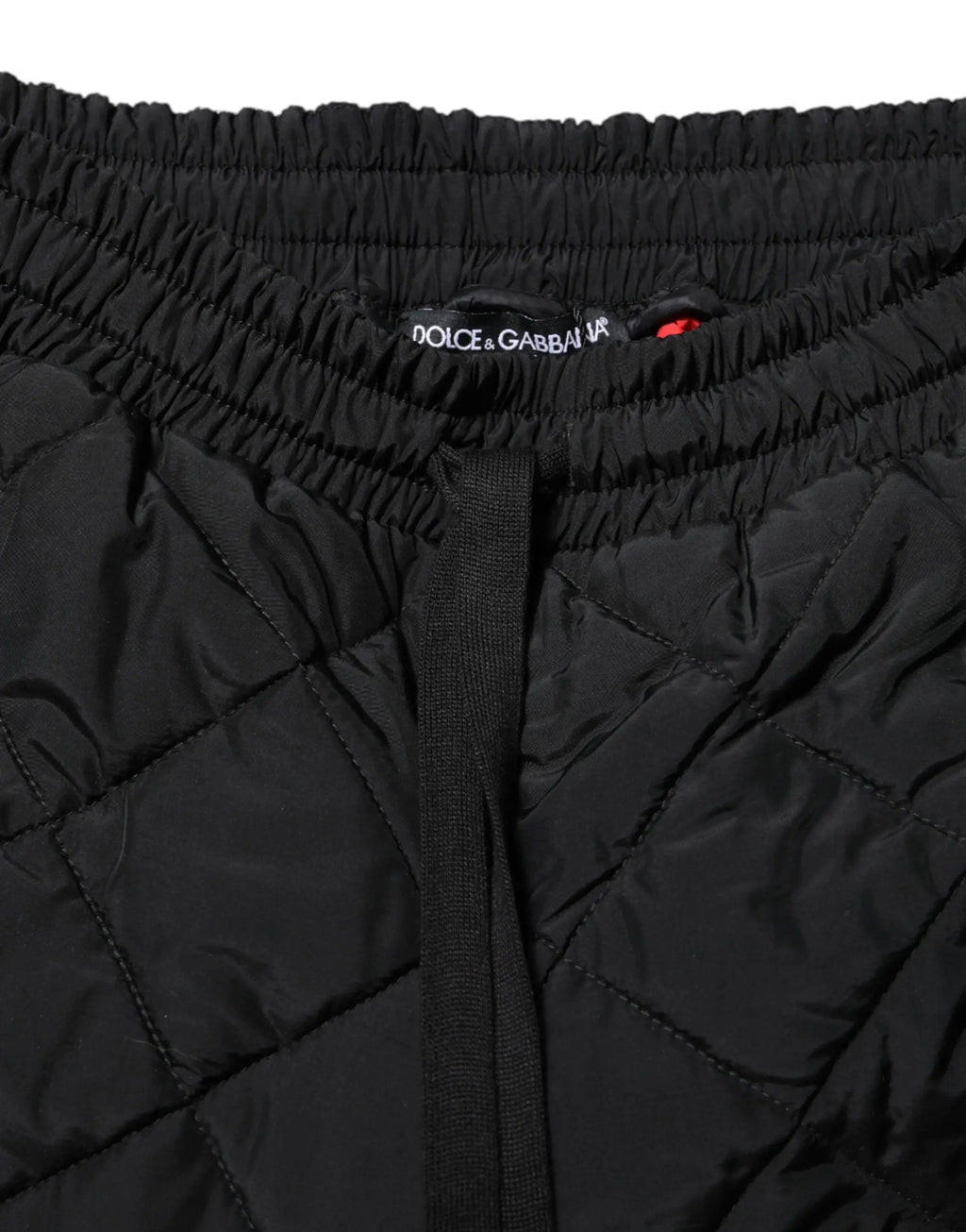 Pantalon jogger dolce gabbana noir matelassé taille mi-haute avec taille ajustable et étiquette de la marque