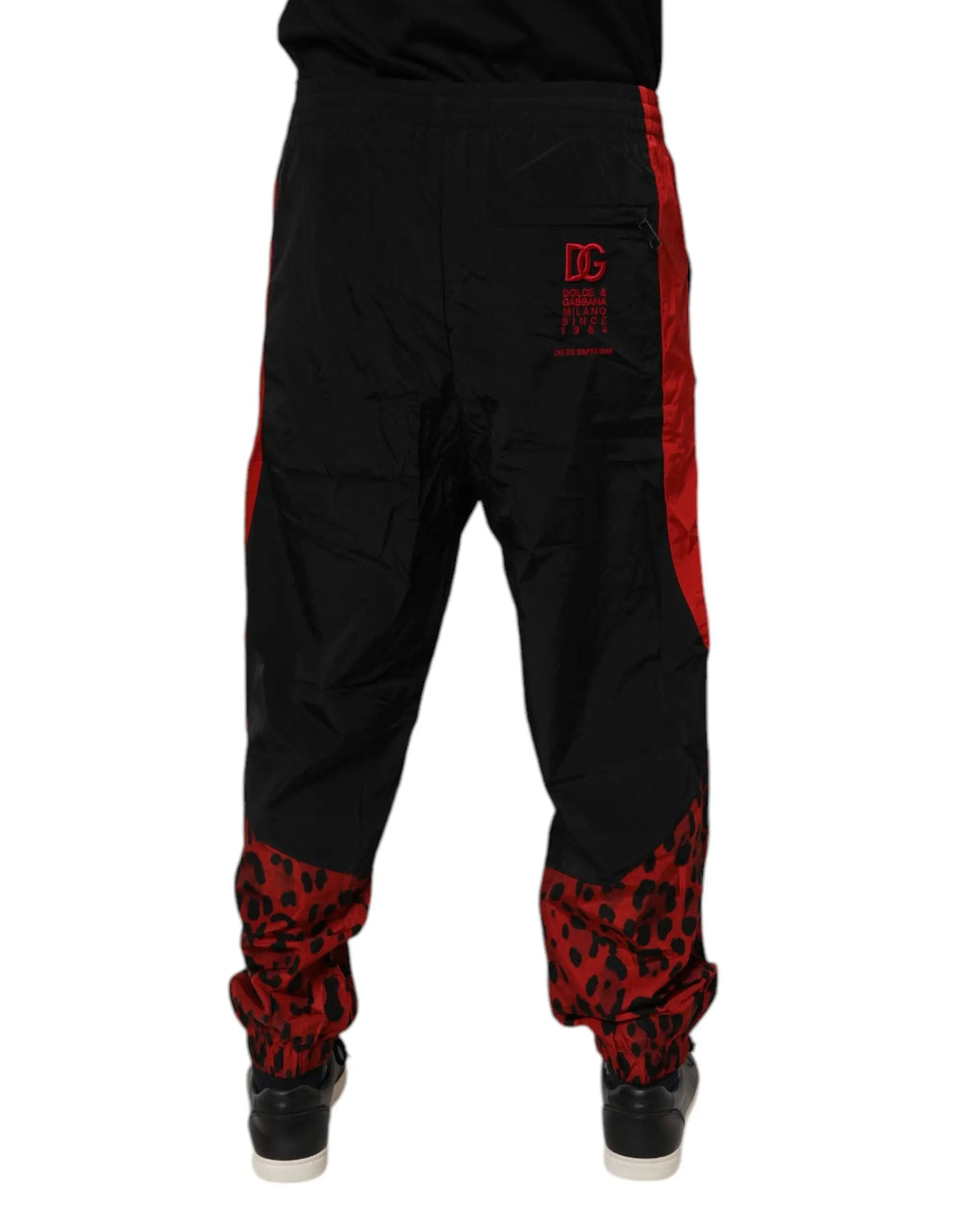 Dolce & gabbana black red nylon jogger pants with bold leopard print cuffs from dc comics collection