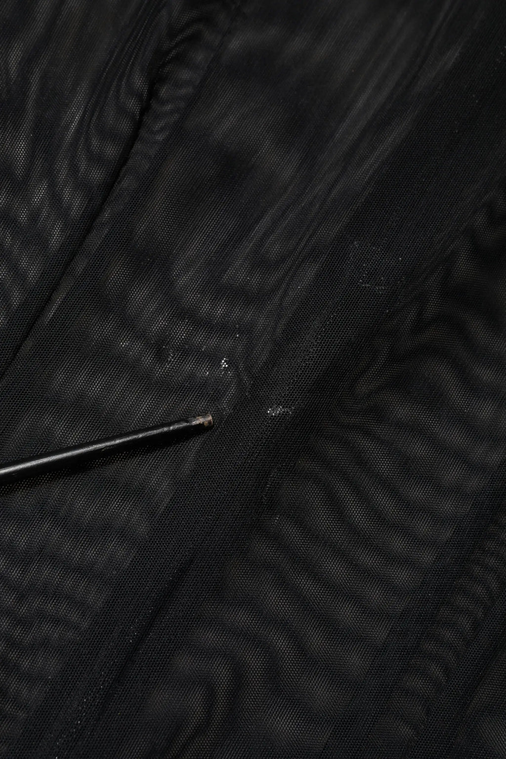 Dolce & Gabbana combinaison noir en mesh transparent à manches longues avec texture tissée subtile et petites imperfections