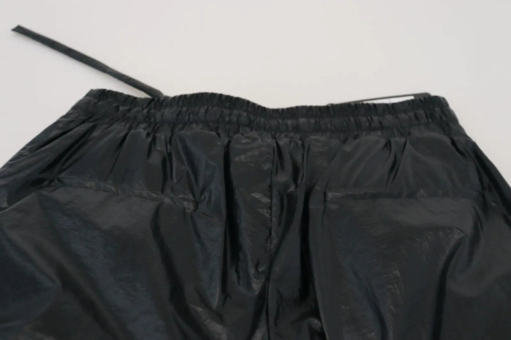 Dolce & gabbana pantalon en nylon noir brillant avec taille élastique et cordon de serrage