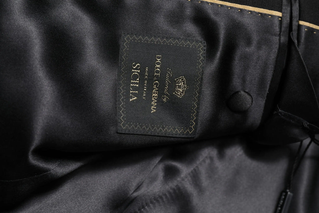Étiquette en satin noir avec broderie dorée dolce & gabbana sicilia et blason sur manteau blazer crystalembelli noir
