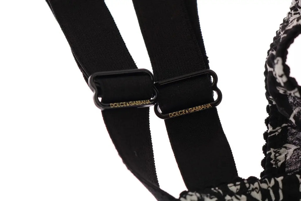 Lanières élastiques noires avec boucles en plastique noir et logo dolce & gabbana doré sur le soutien-gorge dentelle blanche et soie noire