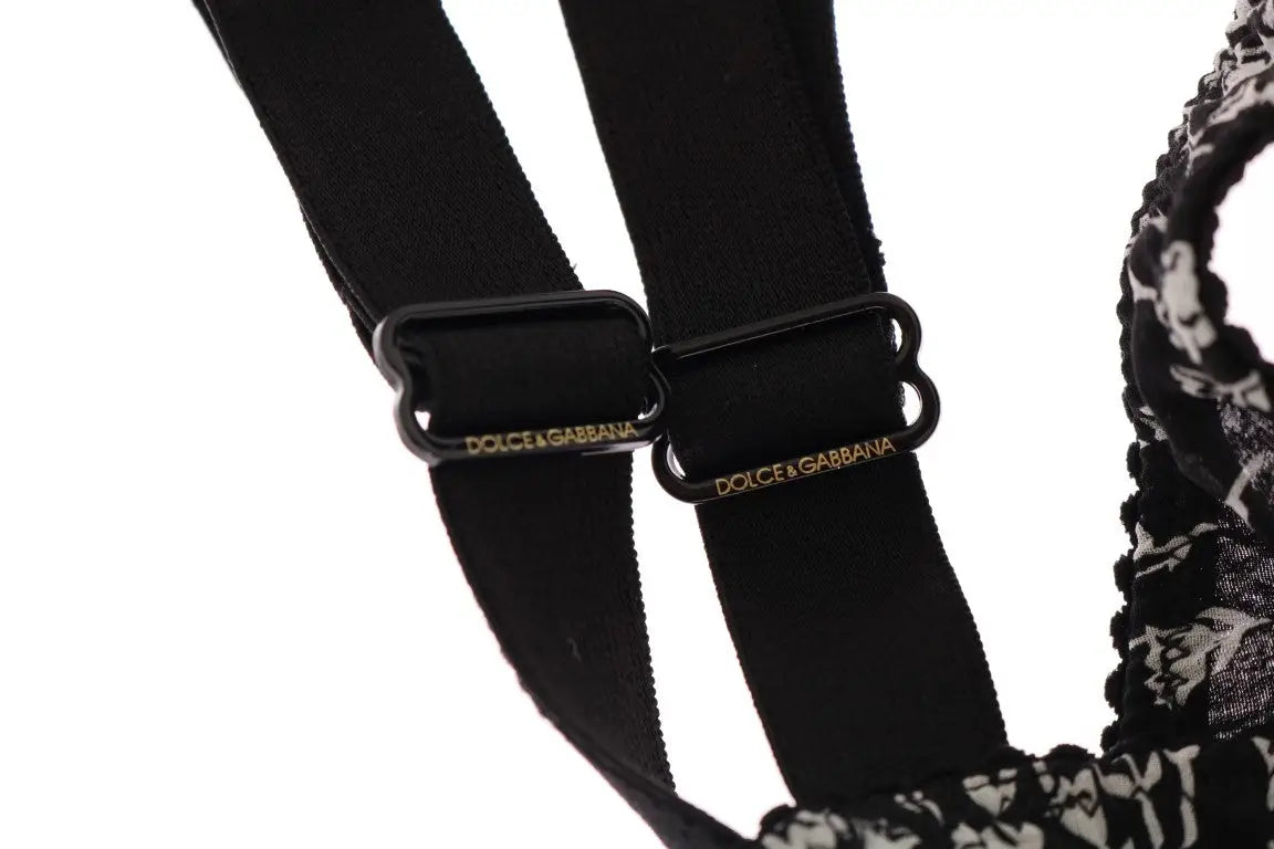 Lanières élastiques noires avec boucles en plastique noir et logo dolce & gabbana doré sur le soutien-gorge dentelle blanche et soie noire