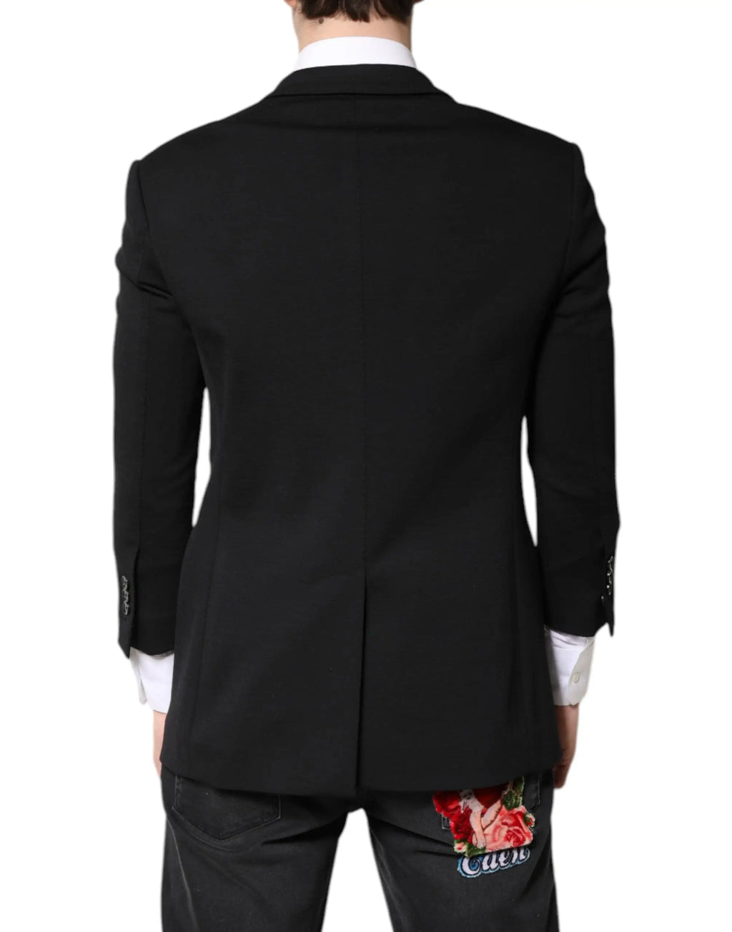 Dos d’un blazer homme noir dolce gabbana en laine avec patch rose brodé subtil et texture élégante