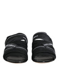Dolce & gabbana black slides slip on sandals with white stitching and brand logos on leather straps