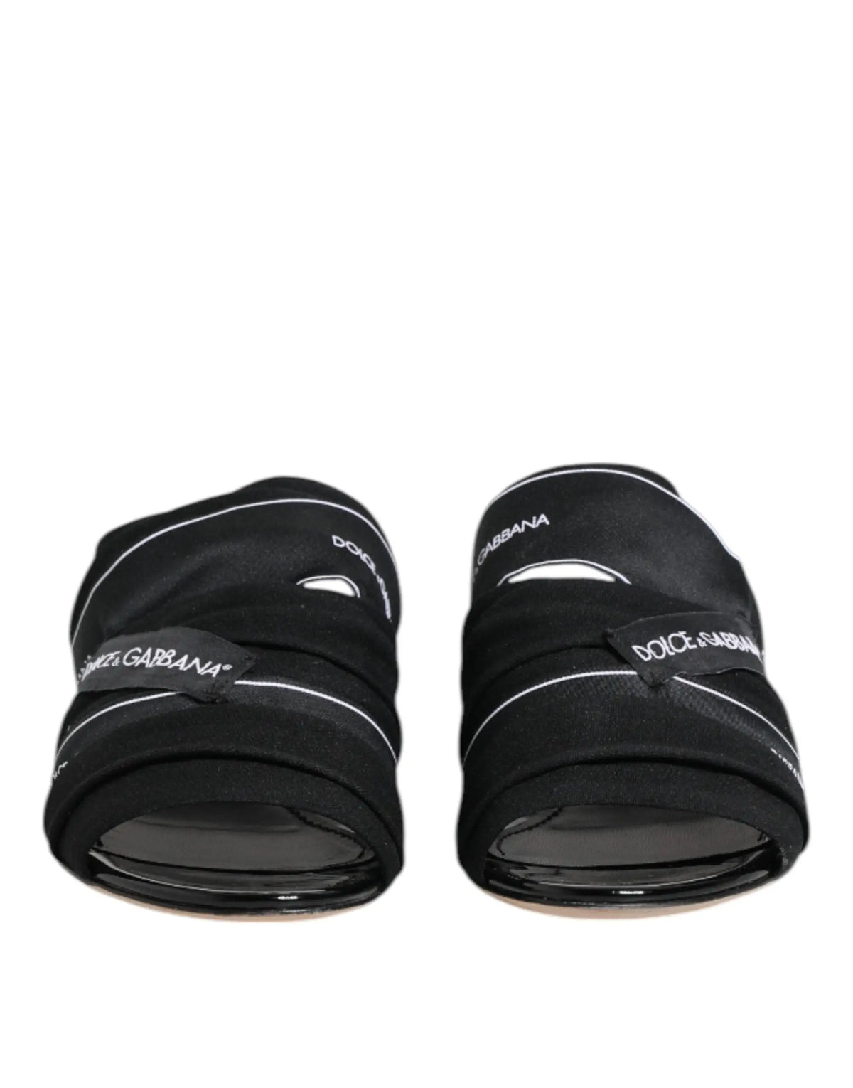 Dolce & gabbana black slides slip on sandals with white stitching and brand logos on leather straps