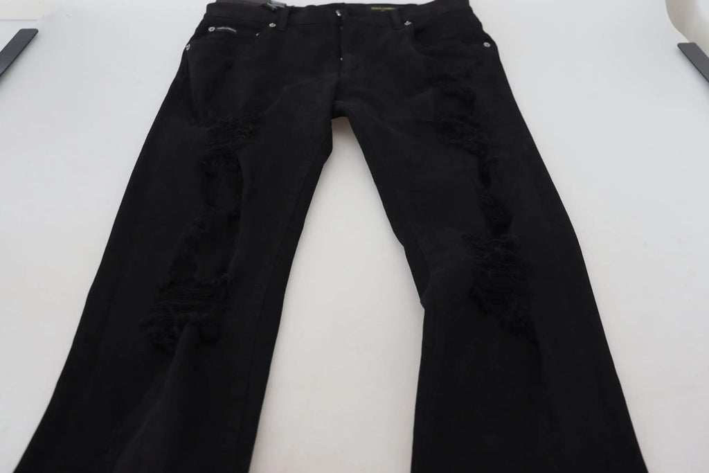 Dolce & Gabbana jean slim fit noir en coton déchiré avec genoux déchirés et accessoires argentés