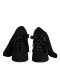 Dolce & gabbana bottes mi-mollet noires en satin avec lacets et talons aiguilles élégants