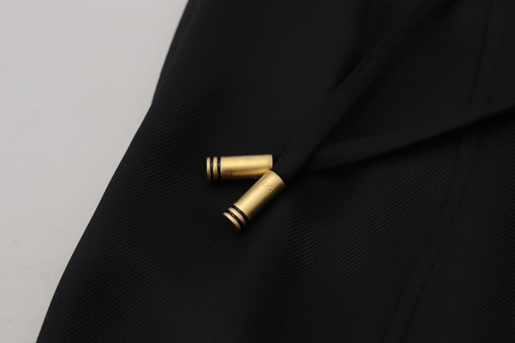 Clips cylindriques dorés avec rayures noires sur un pantalon droit en coton noir dolce & gabbana