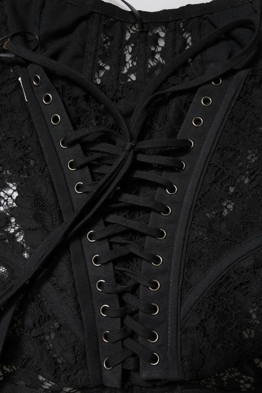 Dolce & gabbana bustier noir en dentelle florale avec laçage ajustable et œillets argentés sans bretelles