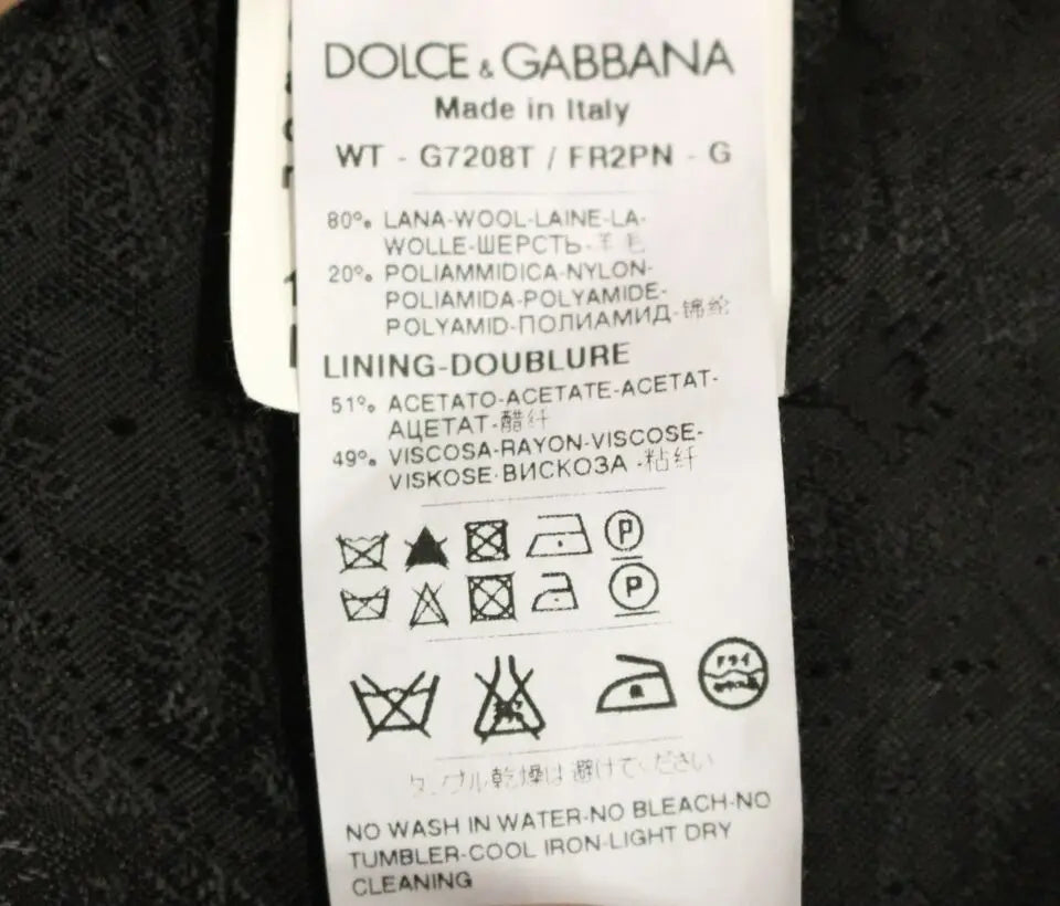 Étiquette dolce & gabbana indiquant un gilet noir à rayures en laine 80 nylon 20 avec doublure acetate viscose