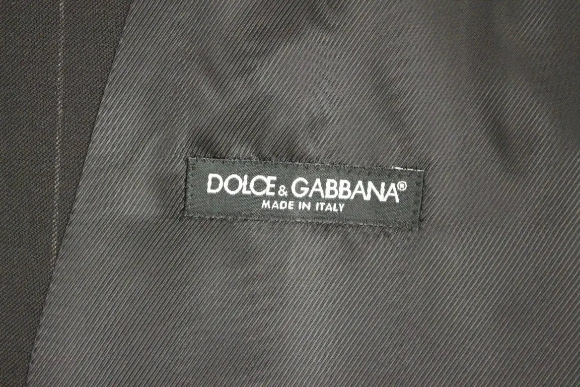 Étiquette dolce & gabbana noire avec texte brodé blanc made in italy sur un gilet en laine rayé noir dolce & gabbana