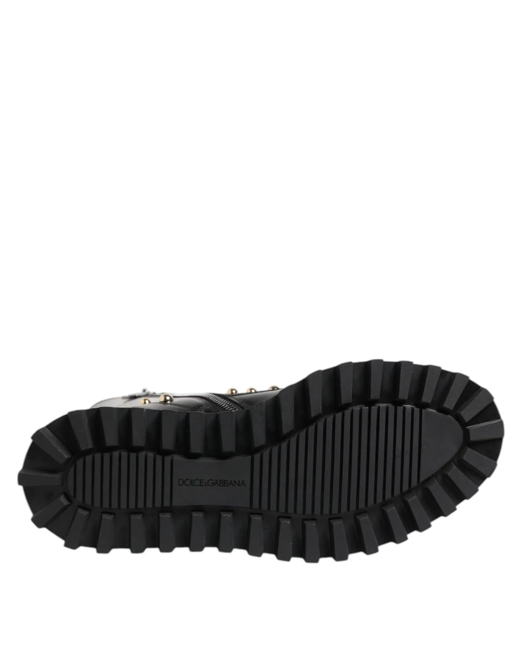 Semelle noire en caoutchouc avec profondes rainures et logo dolce & gabbana embossé sur des bottes montantes à lacets cloutées