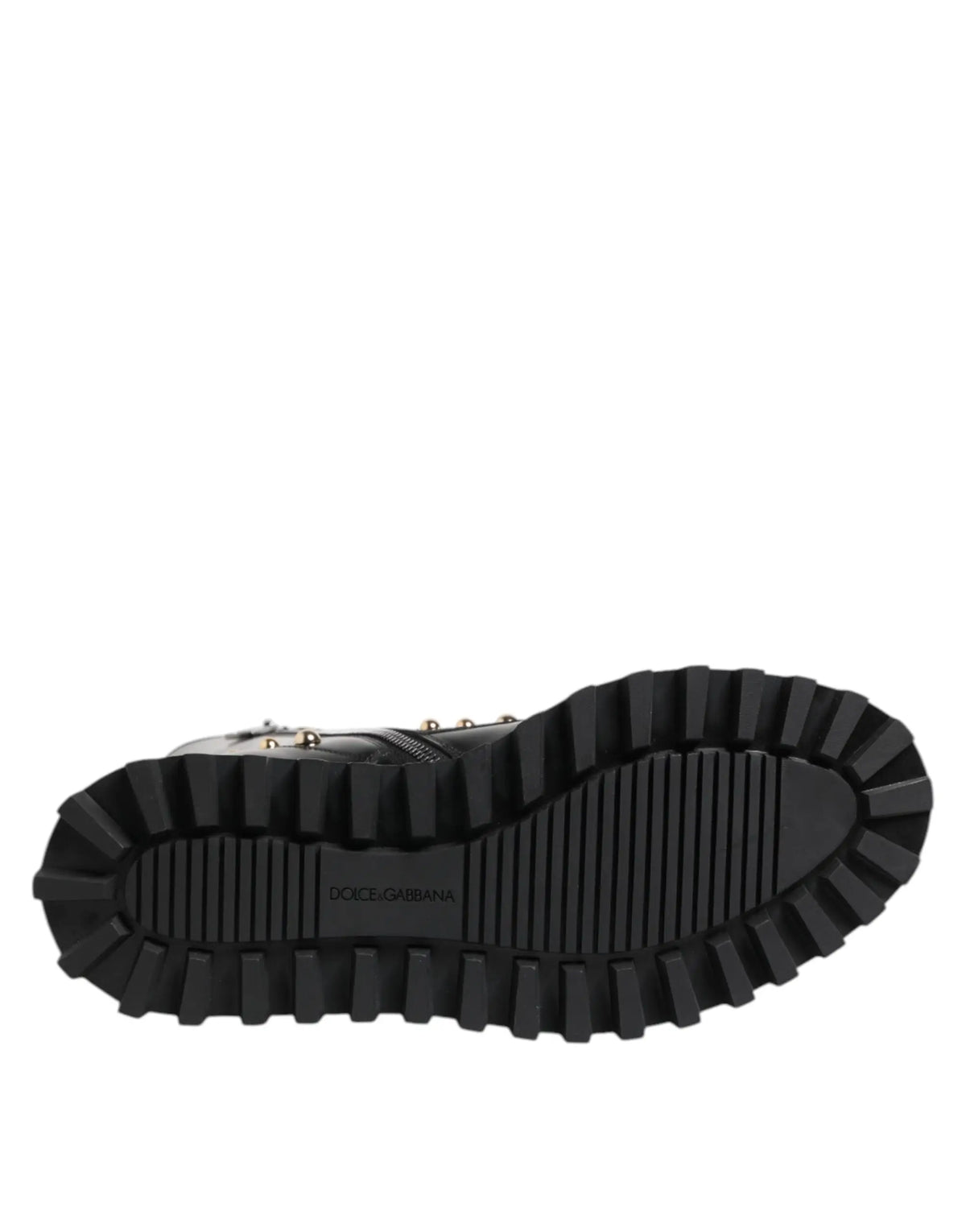 Semelle noire en caoutchouc avec profondes rainures et logo dolce & gabbana embossé sur des bottes montantes à lacets cloutées