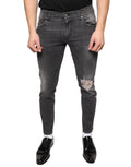 Jeans skinny homme en coton délavé noir dolce & gabbana avec déchirures aux genoux et effet usé