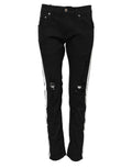 Jean skinny en denim noir dolce gabbana avec rayures blanches latérales et déchirures aux genoux