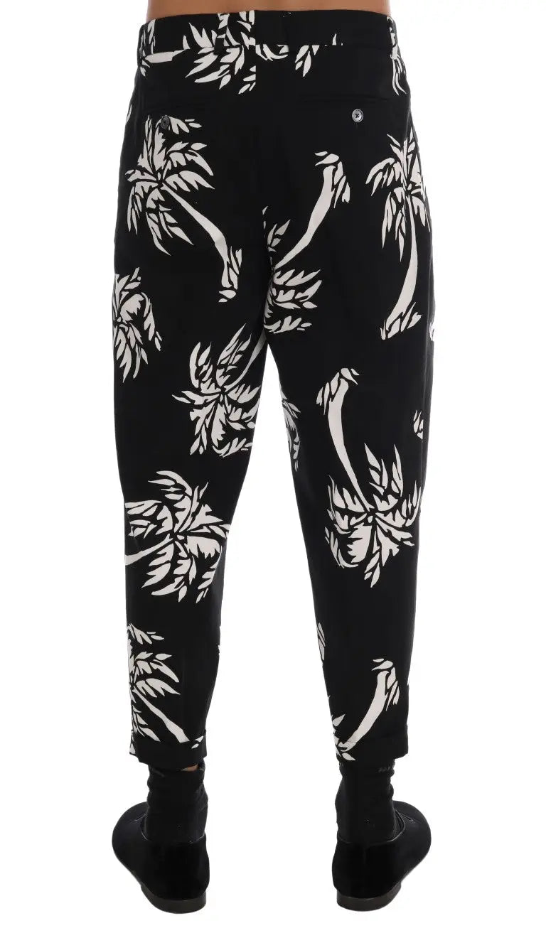 Dolce & Gabbana pantalon noir en coton stretch avec motif palmier blanc audacieux sur le tissu
