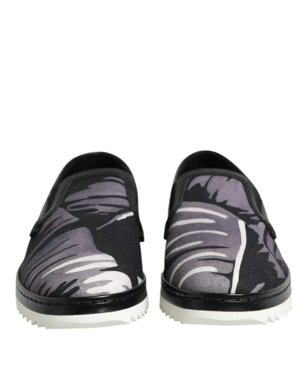 Dolce & gabbana baskets slip on noires pour homme avec motif feuilles tropicales en nuances de gris et semelles blanches contrastées
