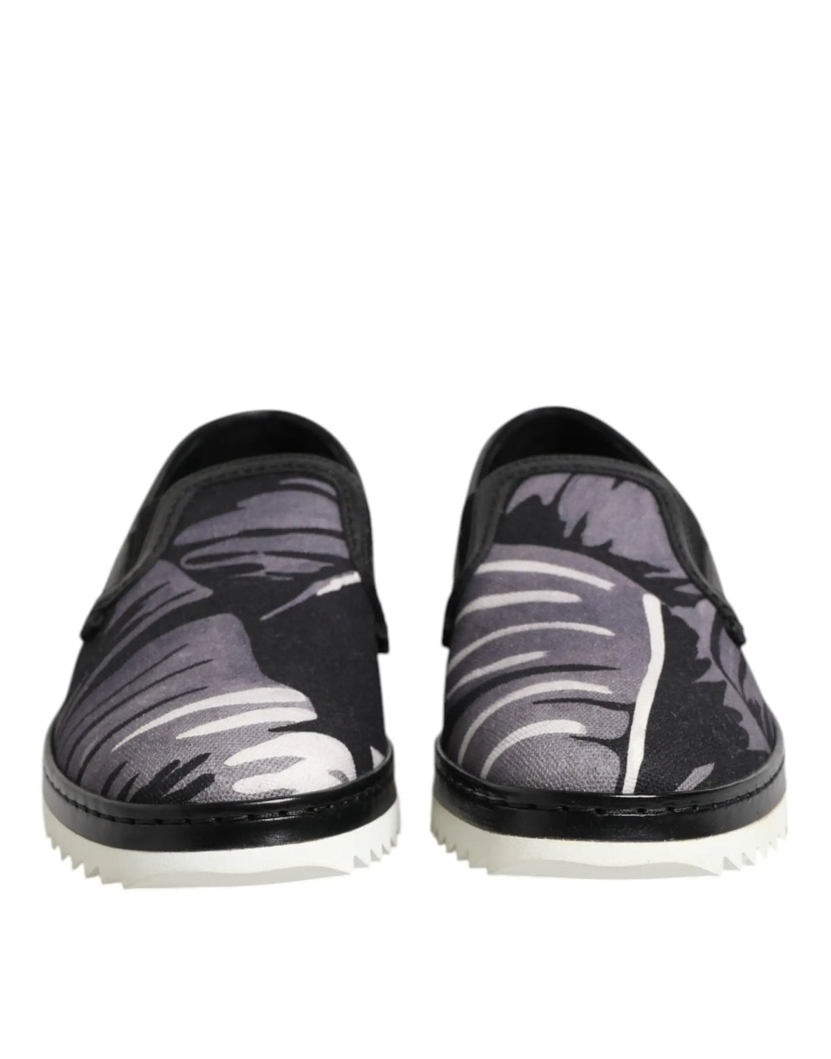 Dolce & gabbana baskets slip on noires pour homme avec motif feuilles tropicales en nuances de gris et semelles blanches contrastées