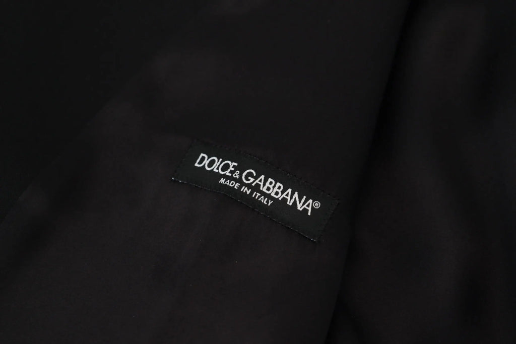Étiquette noire dolce & gabbana avec texte brodé blanc sur gilet formel noir en laine vierge fait en italie