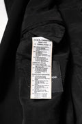 Étiquette noire dolce gabbana sur veste blazer en viscose dg crown avec composition multilingue des tissus