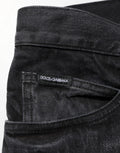 Jean skinny en coton noir lavé pour homme dolce & gabbana avec texture délavée subtile et étiquette de marque sur la ceinture